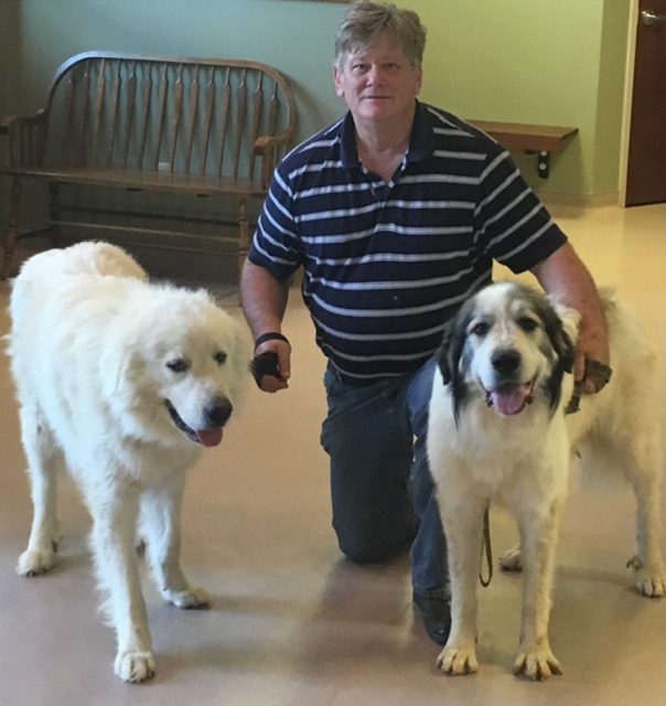 John with two Great Pyrenees
